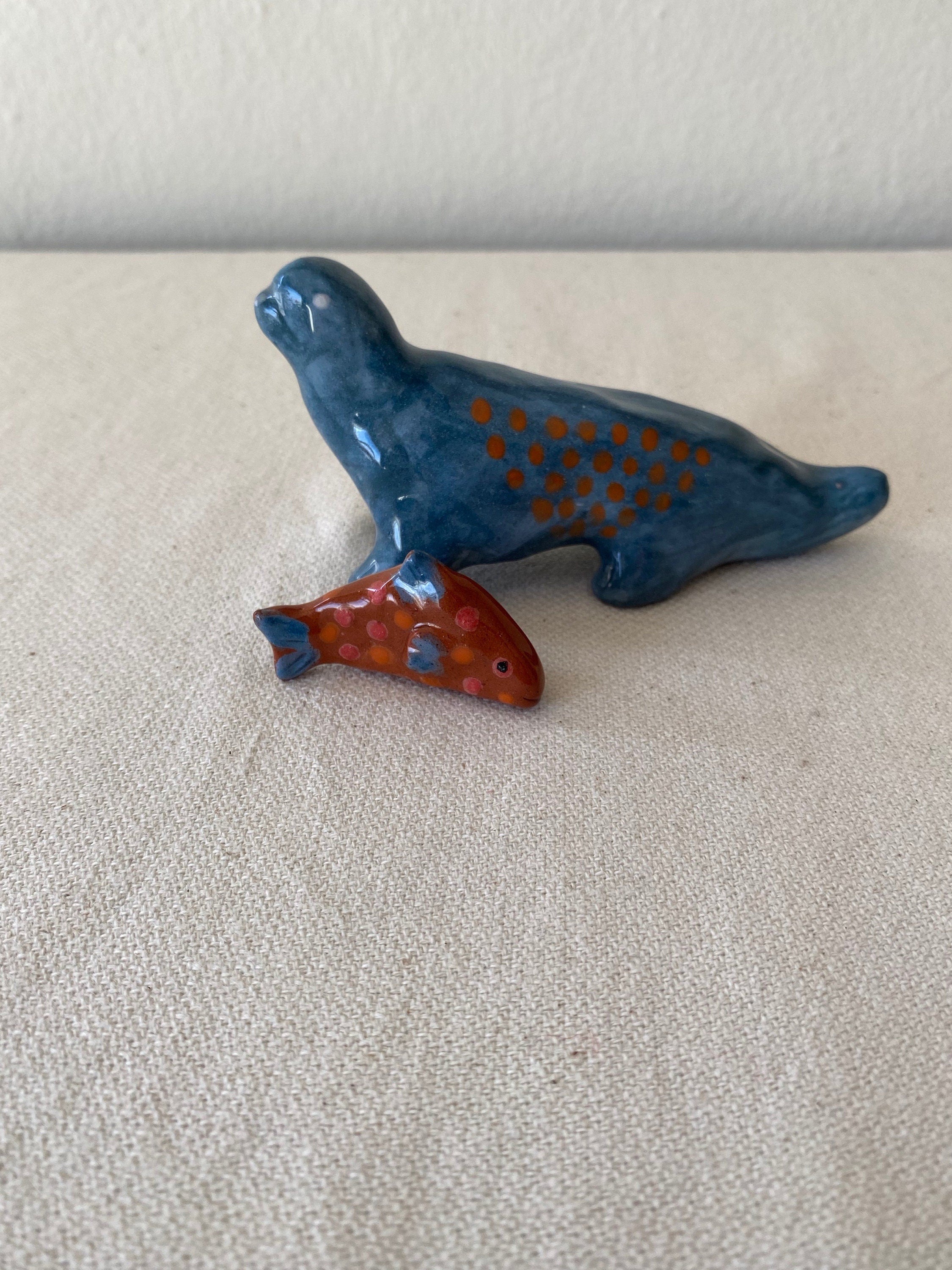 mini ceramic sculpture about 12cm tall
is hand shaping