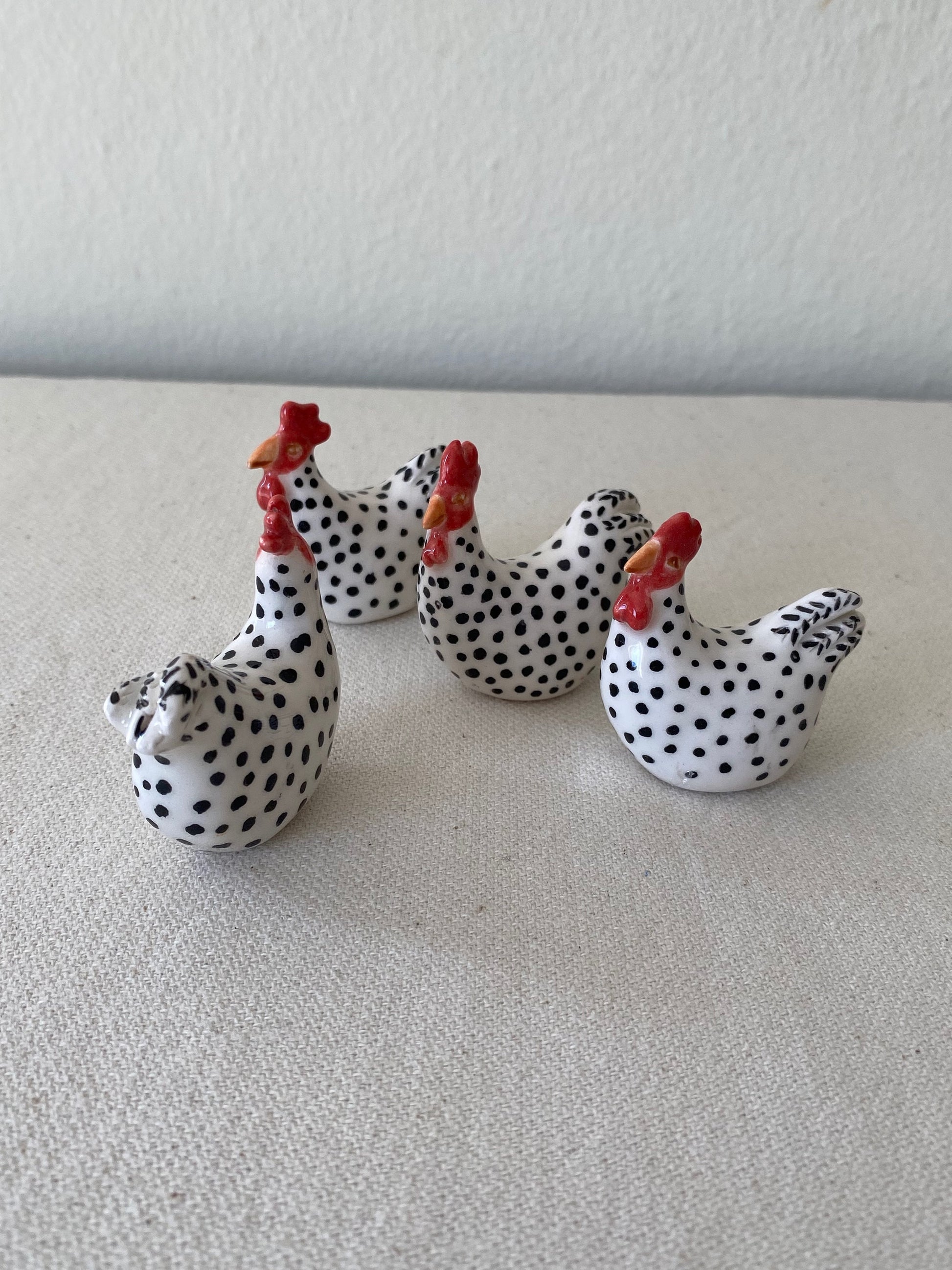 tiny ceramic chicken sculpture
