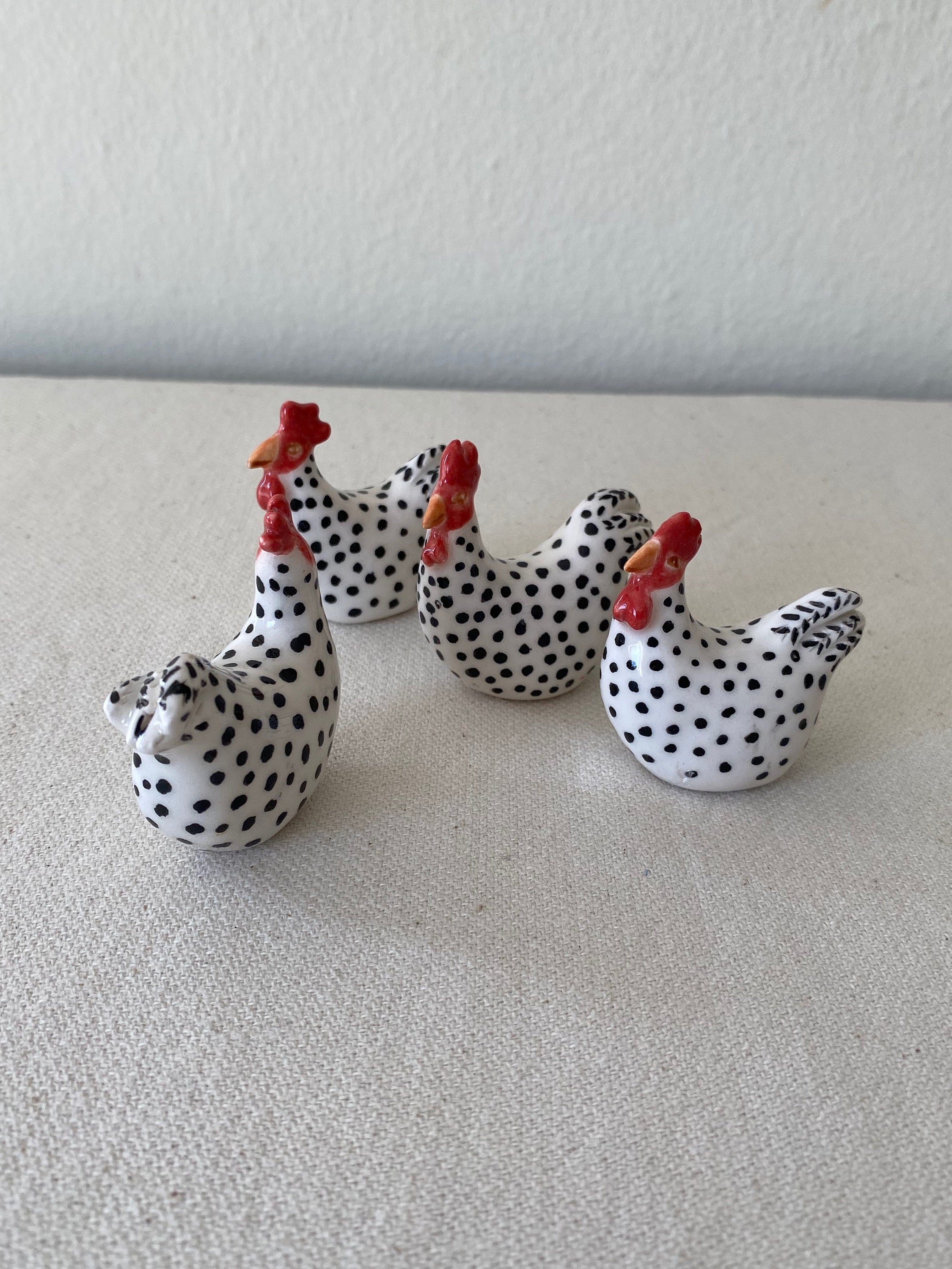tiny ceramic chicken sculpture