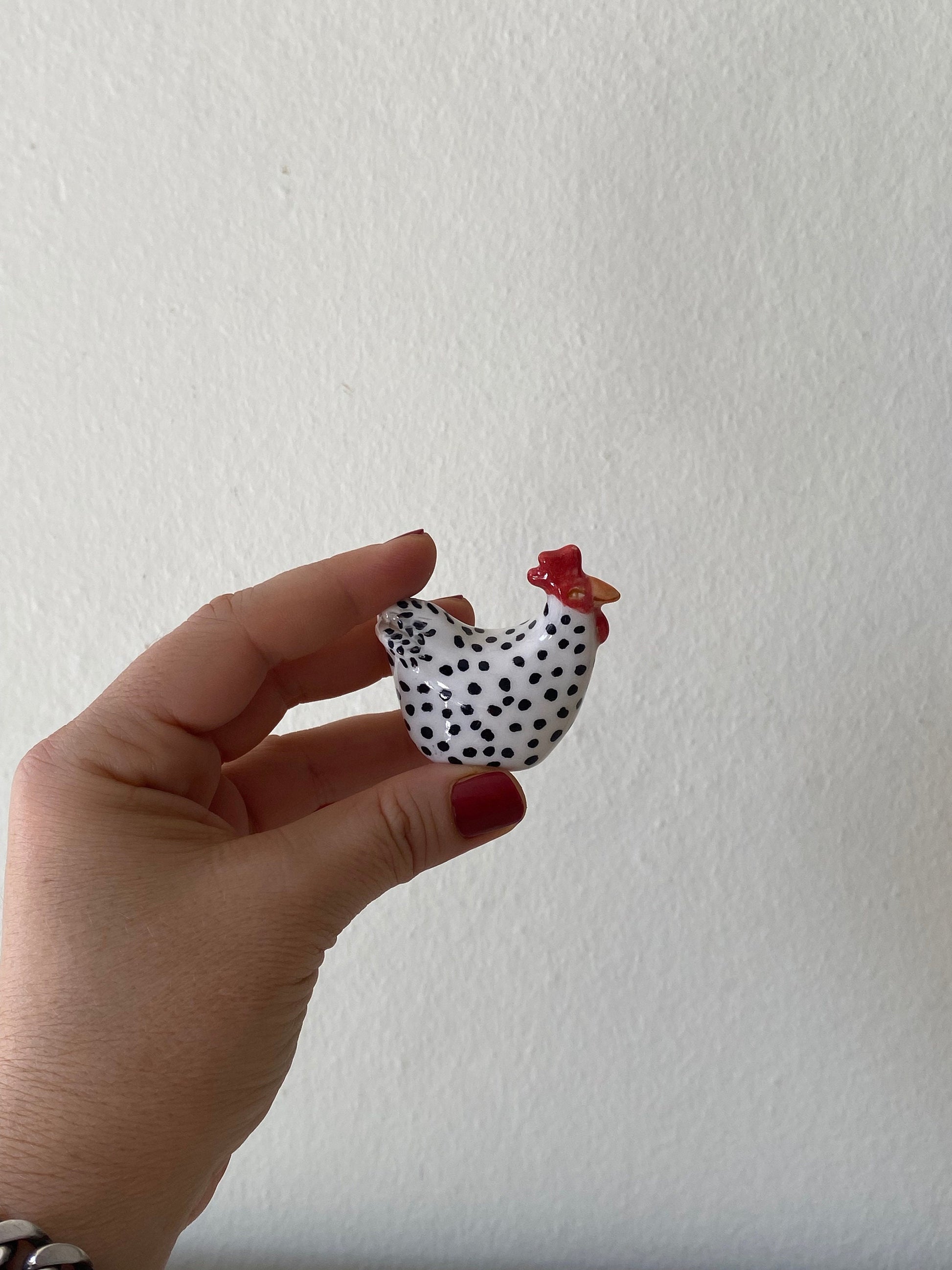 tiny ceramic chicken sculpture