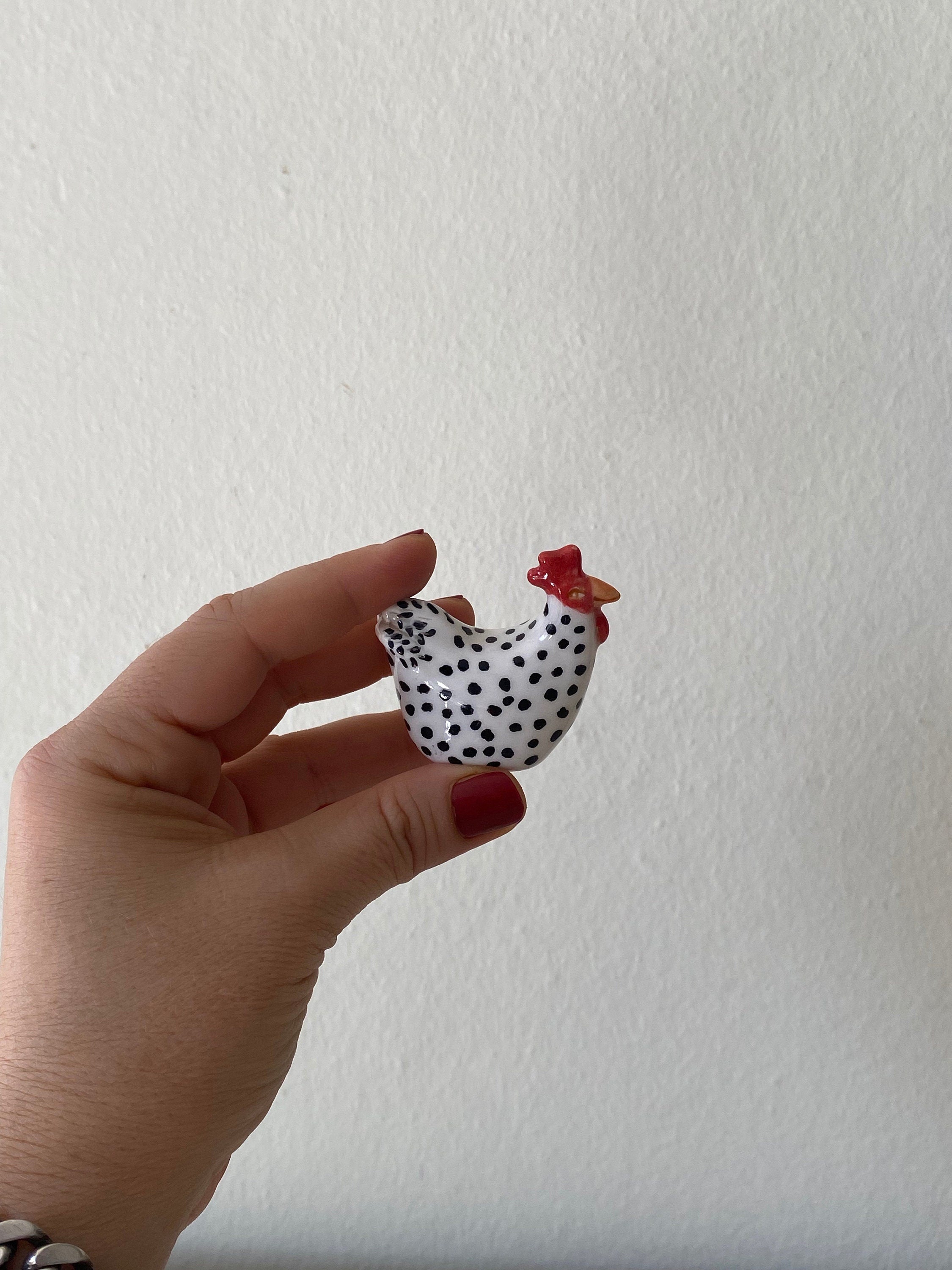 tiny ceramic chicken sculpture